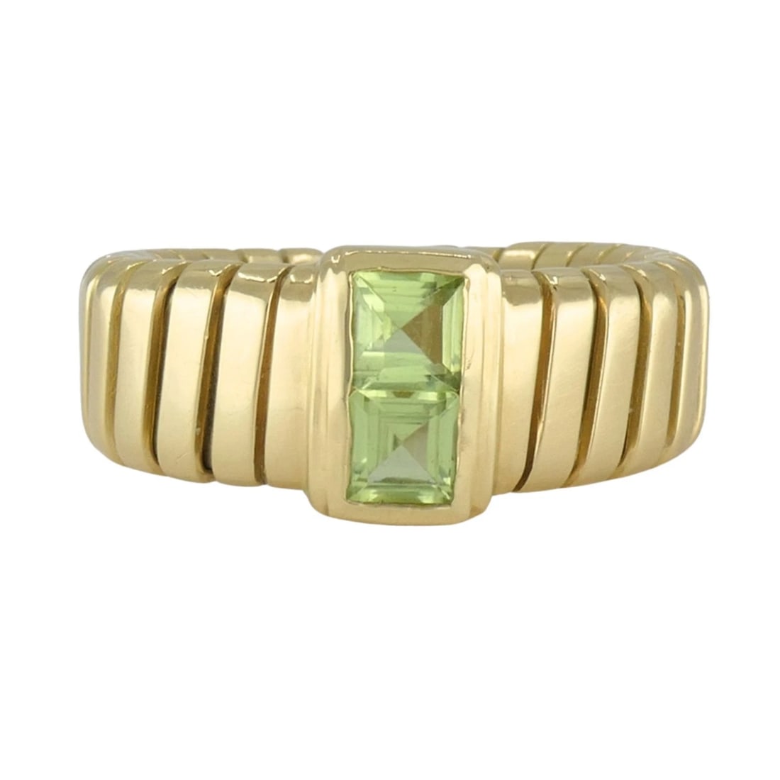 Vintage Bvlgari Bulgari 18k Gold Tubogas Peridot Ring, circa 1990s: KL NUTO Bvlgari 18k yellow gold Tubogas ring, circa 1990s, designed with the maison's famous flexible ribbed Tubogas construction and set with two square cut peridot gemstones at the center. The ring 