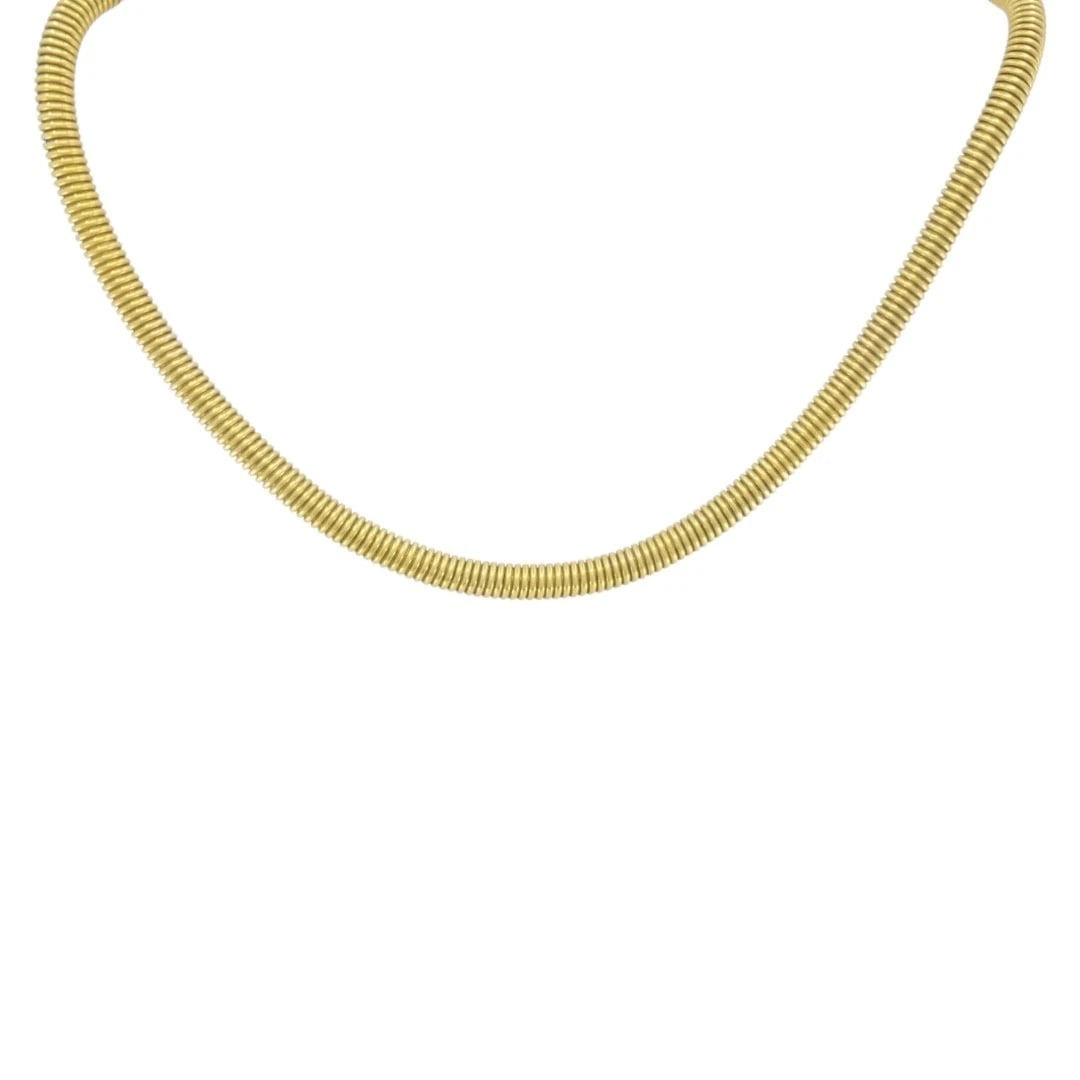 Vintage French 18k Gold Tubogas Coil Necklace: Materials: 18k Gold Weight: 24.3 Grams Measurement: 16 1/2" x 3/16" Hallmarks: Brevete, SGDGITEM DETAILS:Vintage French 18k Gold Tubogas Coil NecklaceA vintage French tubogasâ€‘style 