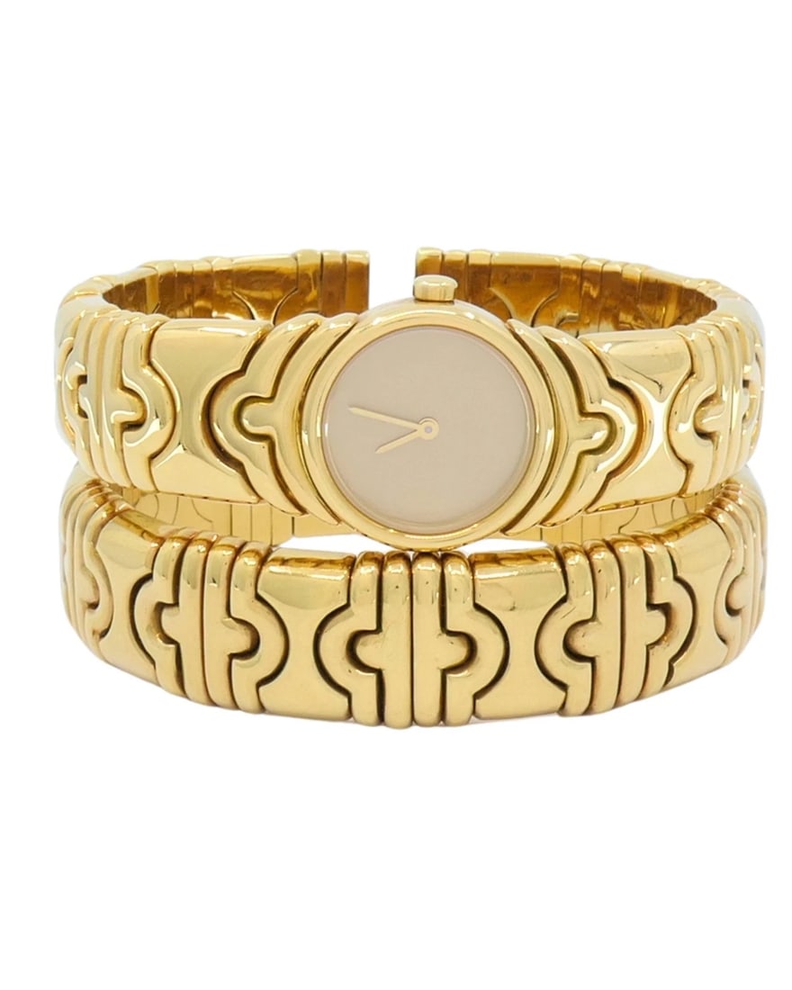 Bvlgari Bulgari Parentesi Gold Watch and Parentesi Bracelet 18k Gold Set: NS UNOOO Bulgari Parentesi Gold Watch and Parentesi Bracelet 18k Gold Set An emblematic vintage set featuring an 18k Bulgari Parentesi watch paired with a coordinating bracelet. The set is designed wi