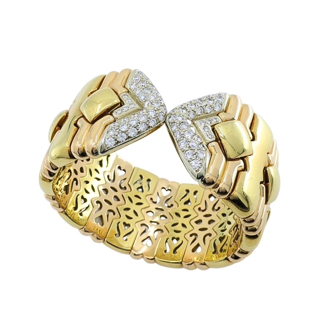Chopard 18k Gold Multicolor Flexible Diamond PavÃ© Cuff Bracelet, 1970s: MATERIALS: 18k Gold, White metal WEIGHT: 151.6 Grams MEASUREMENTS: 5 7/8" x 1 1/8â€ HALLMARKS: 750, L.U.C., BREV.ITEM DETAILS:Chopard 18k Gold Multicolor Flexible Diamond PavÃ