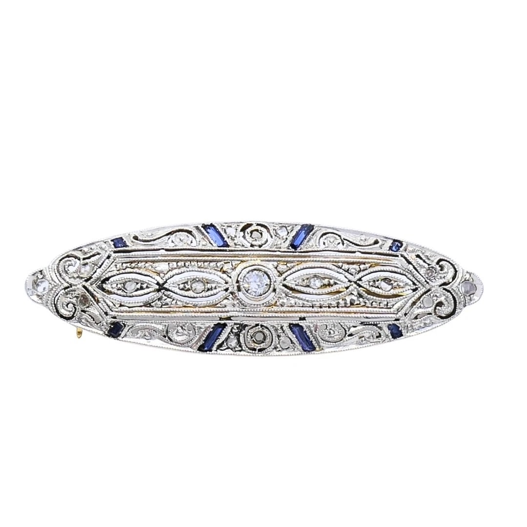 Art Deco 18k Gold Diamond Navette Brooch: MATERIALS: 18k Gold GEMSTONE: Diamond WEIGHT: 2.7 Grams MEASUREMENTS: 1 7/16â€ x 7/16â€ HALLMARKS: 18KITEM DETAILS:Art Deco 18k Gold Diamond Navette BroochAn Art Deco