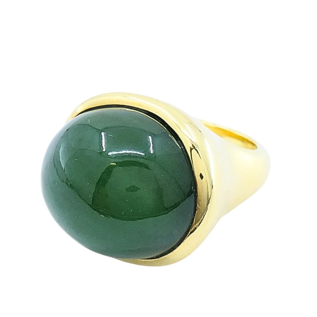 Tiffany & Co. Elsa Peretti 18k Gold Jade Cabochon Dome Ring: DESIGNER: Elsa Peretti for Tiffany & Co. CIRCA: 1990's MATERIALS: 18k Yellow Gold WEIGHT: 22.1 Grams MEASUREMENTS: 5/8" x Â¾" RING SIZE: 7 HALLMARKS: Tiffany & Co., Elsa Peretti, 750, Hong K