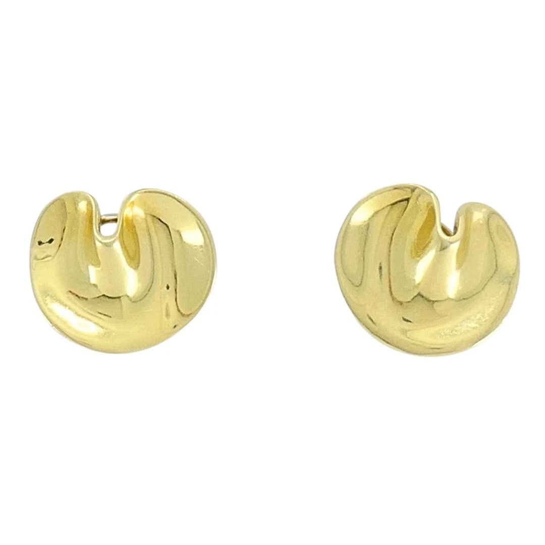 Angela Cummings Tiffany & Co. 18k Gold Lily Pad Earrings: Designer: Angela Cummings for Tiffany & Co. Materials: 18K Yellow Gold Weight: 14.4 Grams Measurement: 7/8" x 3/4" Hallmarks: Cummings, TIFFANY&CO. , 18KITEM DETAILS:Angela Cummings Tiffany & Co. 18k
