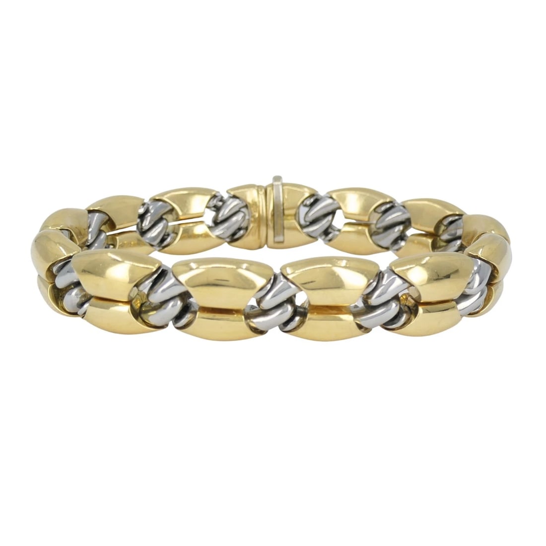 Vintage Bvlgari 18k Gold Steel Link Bracelet: KL EETO This Bulgari Oro Acciaio bracelet is crafted in 18k yellow gold and steel, reflecting the bold, industrial design language associated with the house in the late 1970s to early 1980s. The