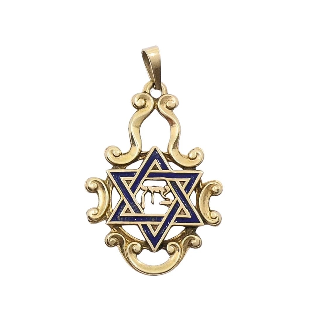 Vintage 14k Gold Blue Enamel Star of David Chai Pendant: CIRCA: Mid-20th Century MATERIALS: 14k Gold, Enamel WEIGHT: 1.6 Grams MEASUREMENTS: 11/16" x 1" HALLMARKS: 14KITEM DETAILS:Vintage 14k Gold Blue Enamel Star of David Chai PendantA 14k gold Star of Dav