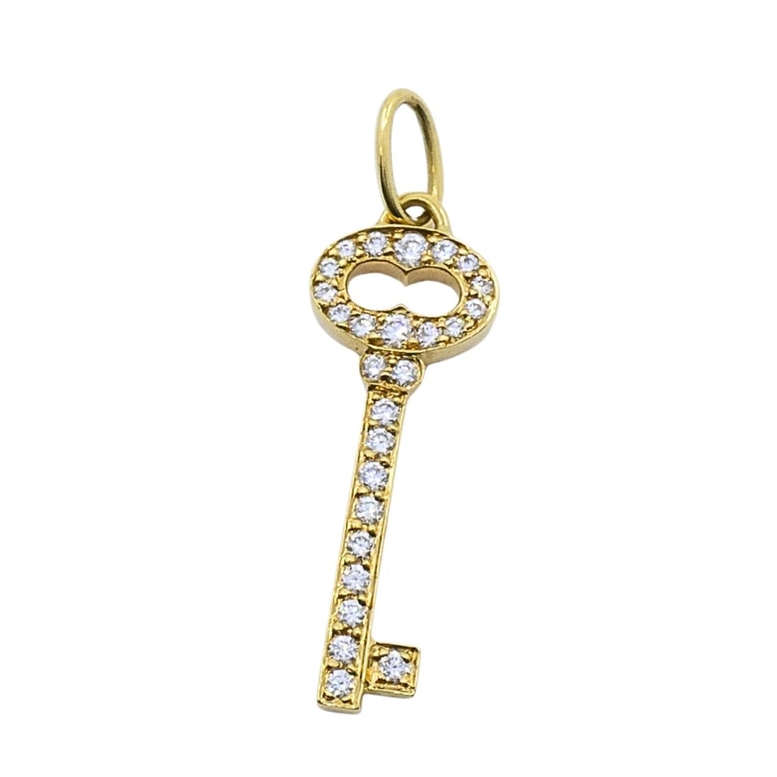 Tiffany & Co. 18k Yellow Gold Diamond Key Pendant: DESIGNER: Tiffany & Co. CIRCA: 2000s MATERIALS: 18K Gold GEMSTONE: Diamond WEIGHT: 1.1 Grams MEASUREMENTS: 5/16" x 13/16" HALLMARKS: Tiffany & Co., 750ITEM DETAILS:Tiffany & Co. 18k Yellow Gold Diamon