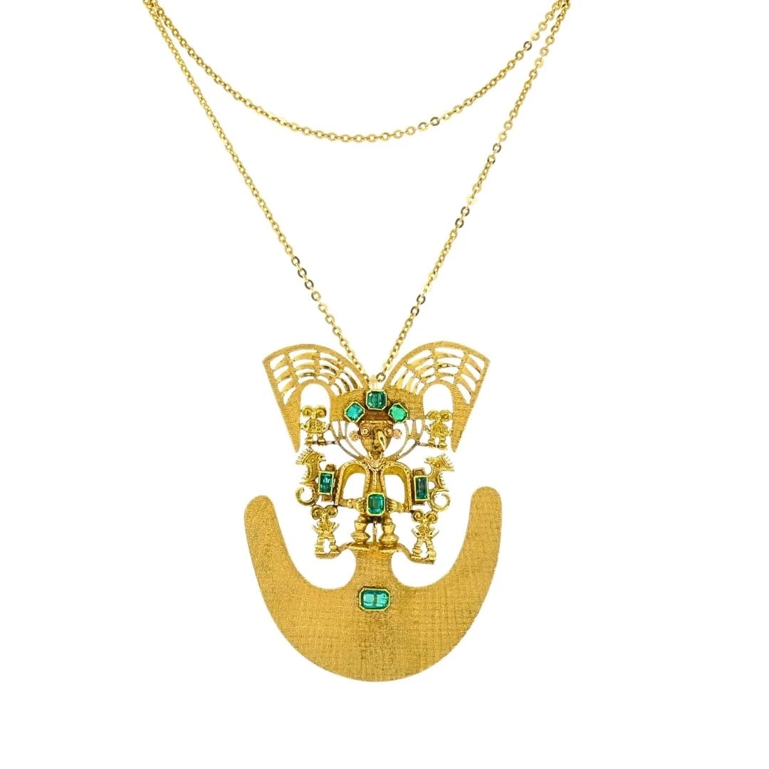 Vintage Preâ€‘Columbian Revival 18k Gold Emerald Tairona Style Pendantâ€: Materials: 18k Gold Gemstones: Emerald Weight: Chain - 6.9 Grams Brooch - 40 Grams Measurement: Brooch - 2 5/16" x 3" Chain - 24" Hallmarks: 18K, 750ITEM DETAILS:Vintage