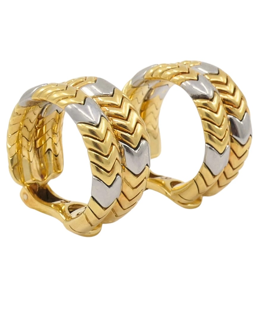 Bvlgari Bulgari Gold Earrings 18k Spiga Collection Chevron Pattern Two-Tone: NS INOO Bvlgari Bulgari Gold Earrings 18k Spiga Collection Chevron Pattern Two-Tone A pair of Bulgari Spiga hoop earrings, made from 18k yellow and white gold, featuring the signature chevron pattern 