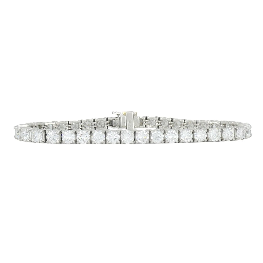 Vintage Cartier Platinum Diamond Tennis Bracelet: KL URTOO An exceptional example of mid-century high jewelry, this Cartier platinum line bracelet is a study in "heavyweight" elegance. Unlike standard tennis bracelets, this piece features a substanti