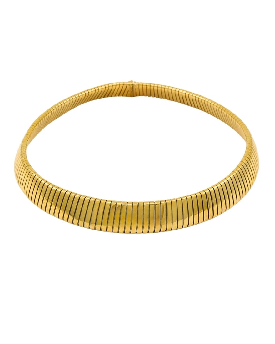 Bvlgari Bulgari Tubogas Necklace 18k Gold & Steel: NS RTOO This vintage Bulgari Tubogas necklace is a great example of the brand's flair for distinct, engineered design. Made from 18k yellow gold and stainless steel, it has a structured look. The flex
