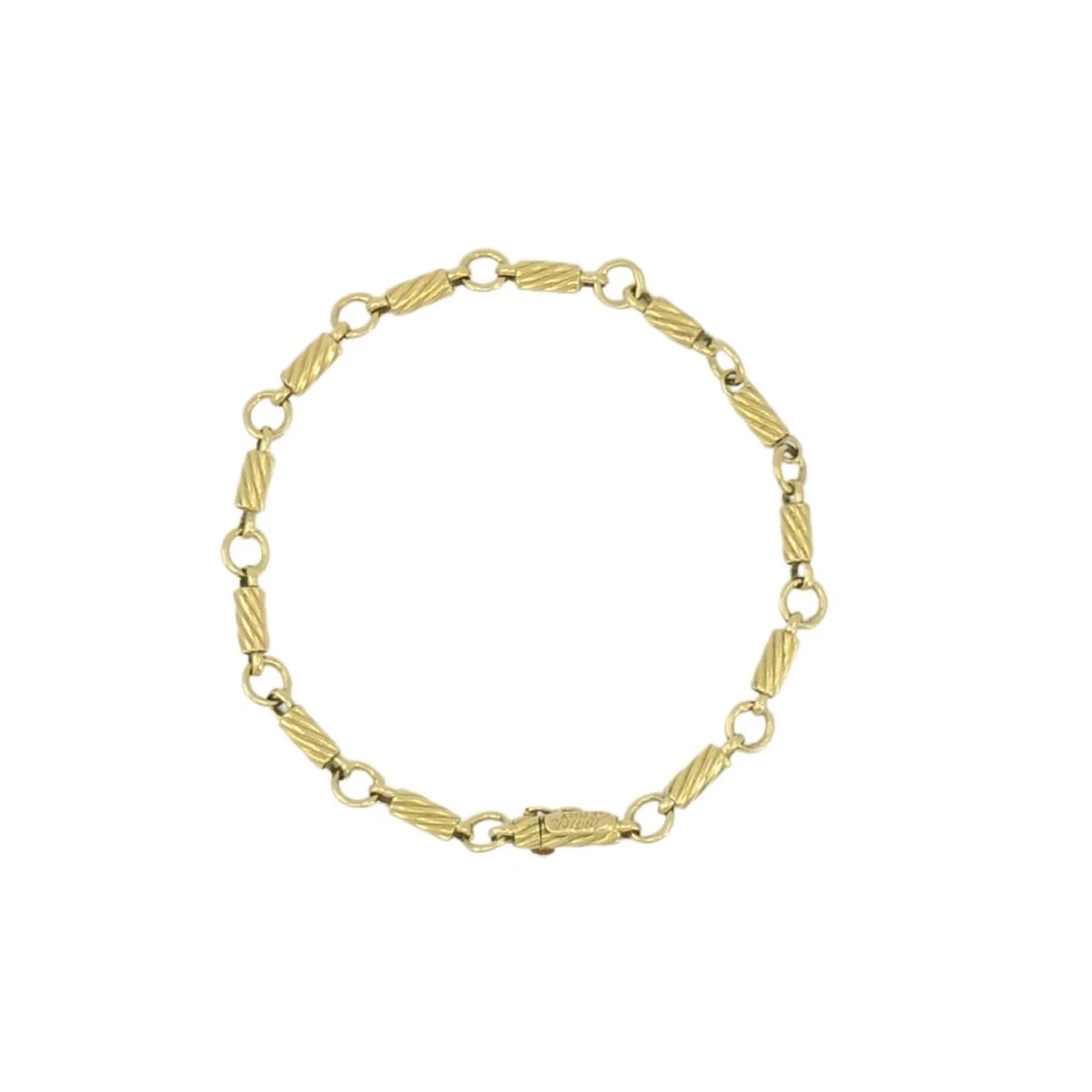 Vintage Cartier 18k Gold Link Bracelet: NS UOOO Vintage Cartier 18k Gold Link Bracelet This vintage Cartier bracelet is crafted in 18k gold and features a refined link pattern composed of alternating elongated and rounded links. Cartier is
