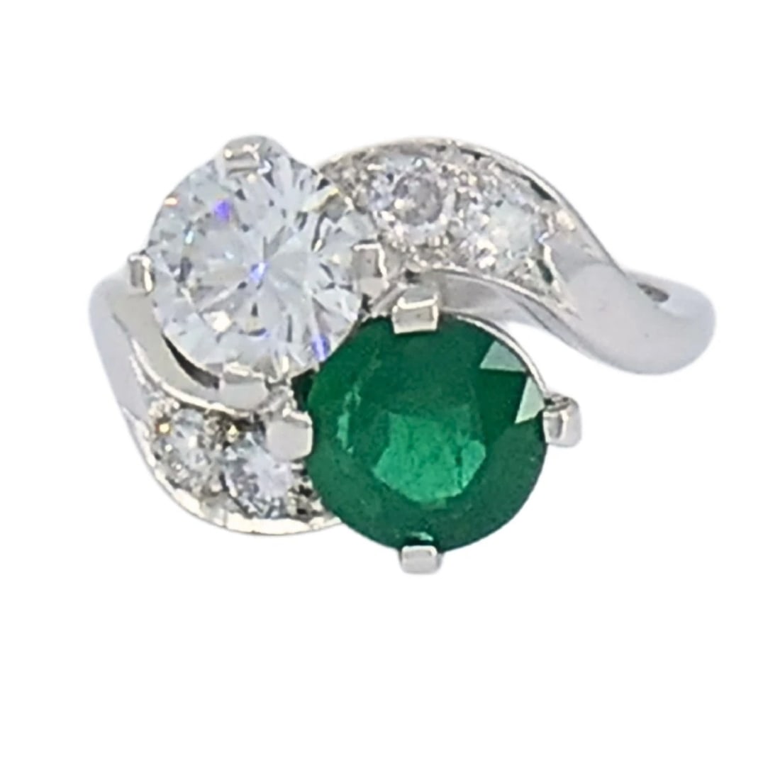 Vintage Platinum Toi et Moi Engagement Ring Diamond Emerald: NS GTOO Vintage Platinum Toi et Moi Engagement Ring Diamond Emerald This vintage platinum ring is designed in the classic Toi et Moi style, pairing a diamond and an emerald in a balanced, sculptural s