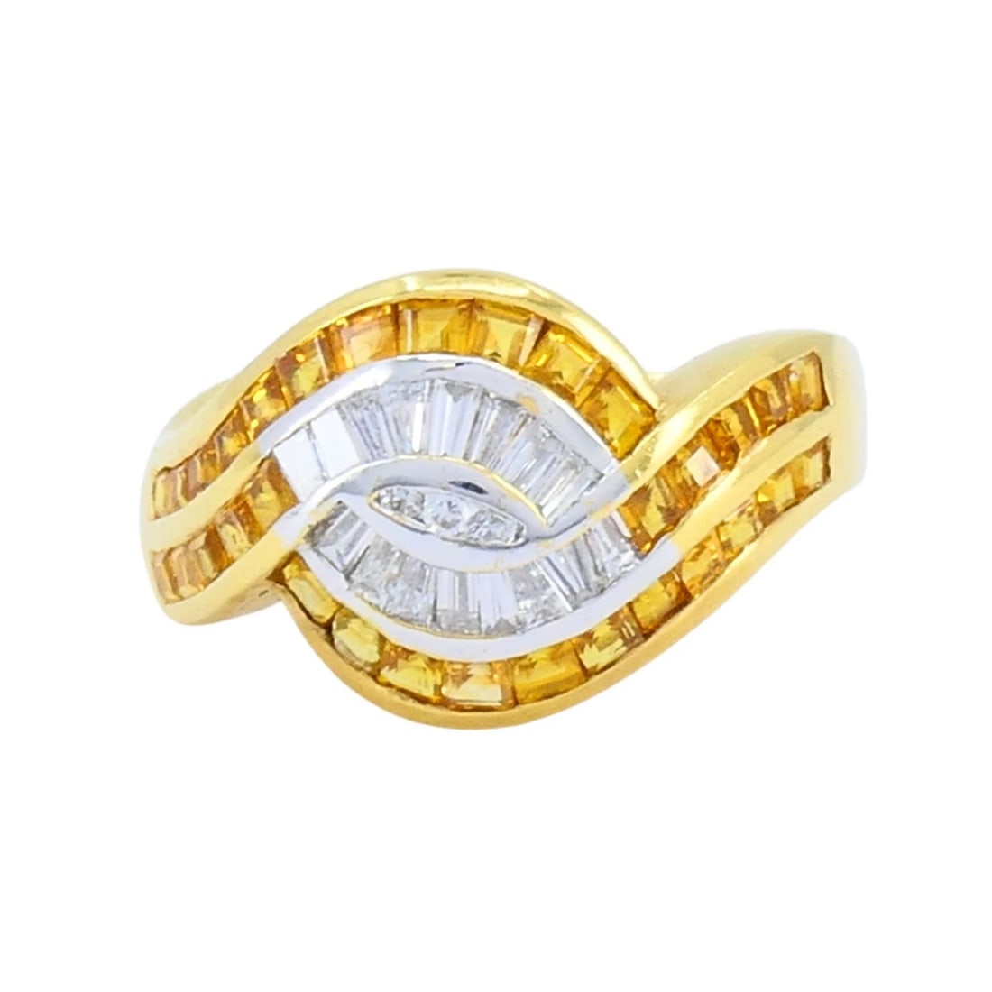 Vintage French 18k Gold Diamond Citrine Ring: KL ITO This French 18k gold ring features a distinctive wave motif set with tapered baguette diamonds at the center and channel-set baguette citrines along the outer curves. The diamonds are arranged 