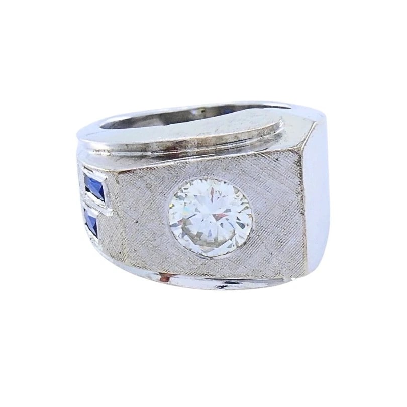 Vintage 14k White Gold Diamond Sapphire Angular Ring: DESIGNER: Unknown CIRCA: Mid-20th Century MATERIALS: 14k GoldGEMSTONE: DiamondWEIGHT: 10.3 GramsMEASUREMENTS: Top Width - width 7/16"RING SIZE: 3.25 - 3.5 HALLMARKS: 14ITEM DETAILS:Vintage 14k White G
