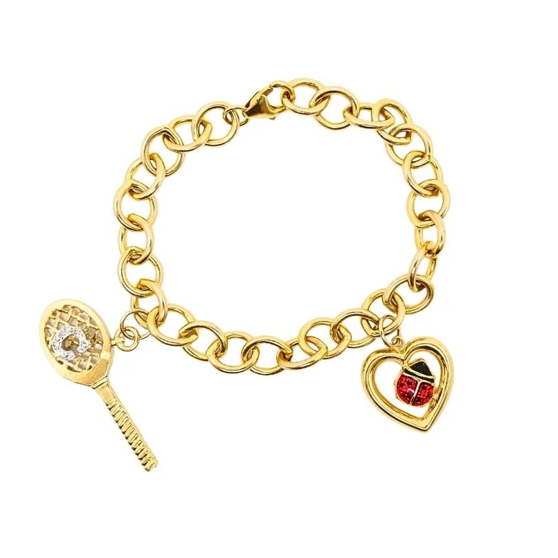 14k Gold Link Charm Bracelet Vintage Jewelry: DESIGNER: Unknown CIRCA: Late 20th Century MATERIALS: 14k Gold, EnamelWEIGHT: 17.7 GramsMEASUREMENTS: 1/4â€ x 6 7/8"HALLMARKS: 14K, 585ITEM DETAILS:14k Gold Link Charm Bracelet Vintag