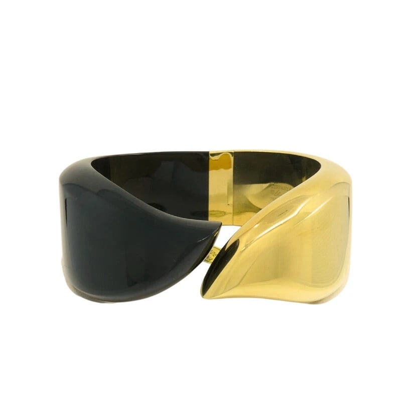 Elsa Peretti for Tiffany & Co. Cuff Bracelet Black Jade 18k Gold: NS JTOOO A vintage cuff bracelet by Elsa Peretti for Tiffany & Co., made of 18k gold and black jade. The shape and balance of this Peretti's bracelet is really striking. One side is carved from smooth
