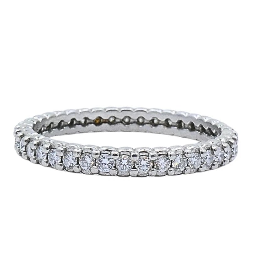 Morelli Platinum Pinpoint Diamond Eternity Ring: DESIGNER: Paul Morelli CIRCA: Late 20th Century MATERIALS: PlatinumGEMSTONE: DiamondWEIGHT: 2.5 GramsMEASUREMENTS: 1/8" Width RING SIZE: 5.5 not resizable HALLMARKS: Morelli, PT950ITEM