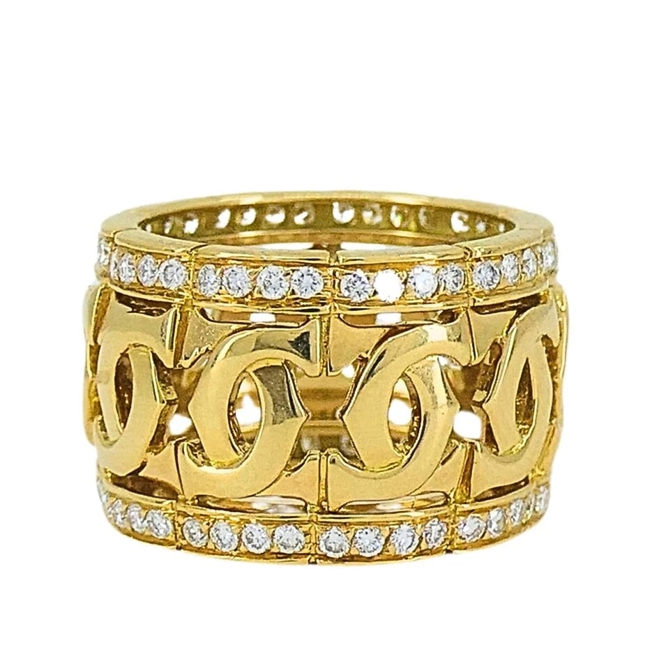 Cartier Entrelaces C de Cartier Diamond Ring Wide Band: DESIGNER: Cartier CIRCA: 1990's MATERIALS: 18k Yellow GoldGEMSTONE: 0.65 cts Round Brilliant Cut DiamondWEIGHT: 12.6 GramsMEASUREMENTS: 1/2" Width RING SIZE: 6 HALLMARKS: Cartier, 750, 715644ITEM DETA