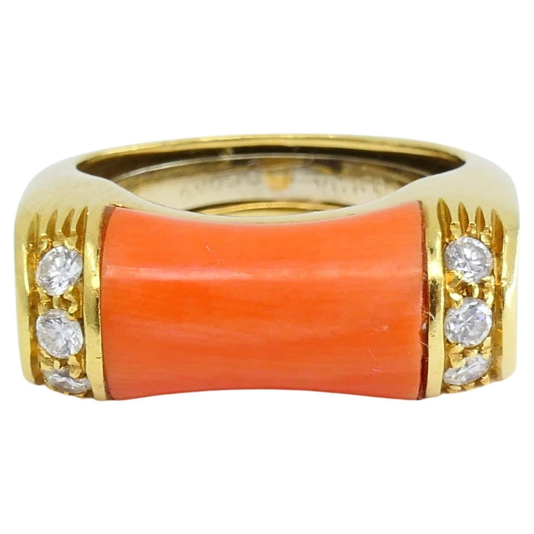 Van Cleef & Arpels Ring Coral Diamond 18k Gold: NS NGTO Van Cleef & Arpels Ring Coral Diamond 18k Gold A Van Cleef & Arpels ring crafted in 18k gold and coral, accented with diamonds. The coral, shaped like a bamboo link, is encrusted with three ve