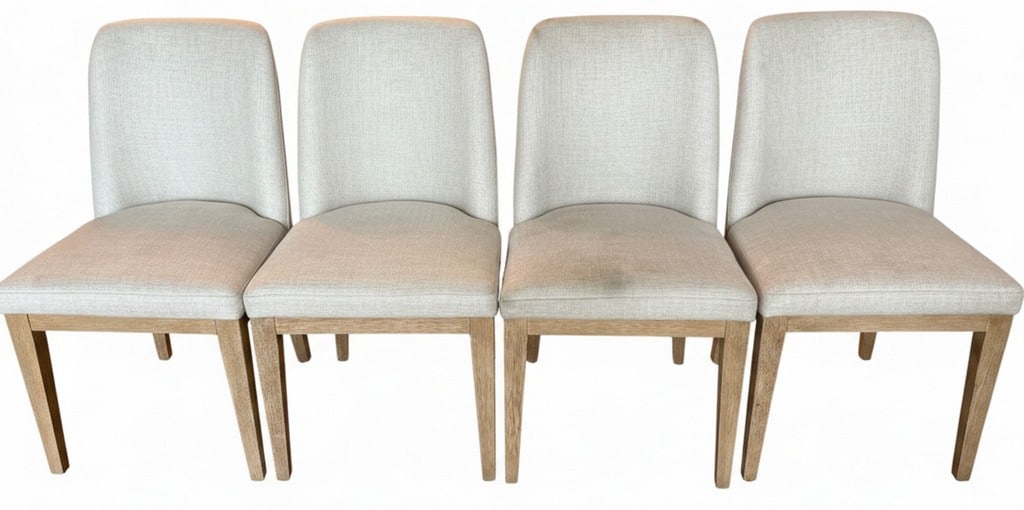 Set of Four Contemporary Upholstered Dining Chairs: A set of four contemporary dining chairs featuring an open back design, light-toned fabric upholstery, and natural wood legs. The chairs are versatile and would complement various interior styles.