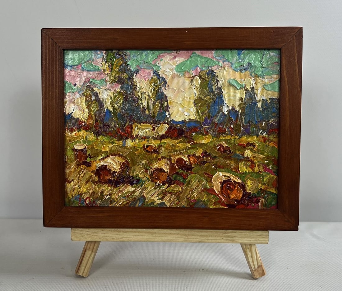 Oil painting Haystacks in the field Alex Kalenyuk: AAA4684 The oil painting on canvas titled "Haystacks in The Field" captures The rustic beauty of a harvested field ba Thed in The warm glow of The sun. The artist uses bold, impasto brushstrokes and a