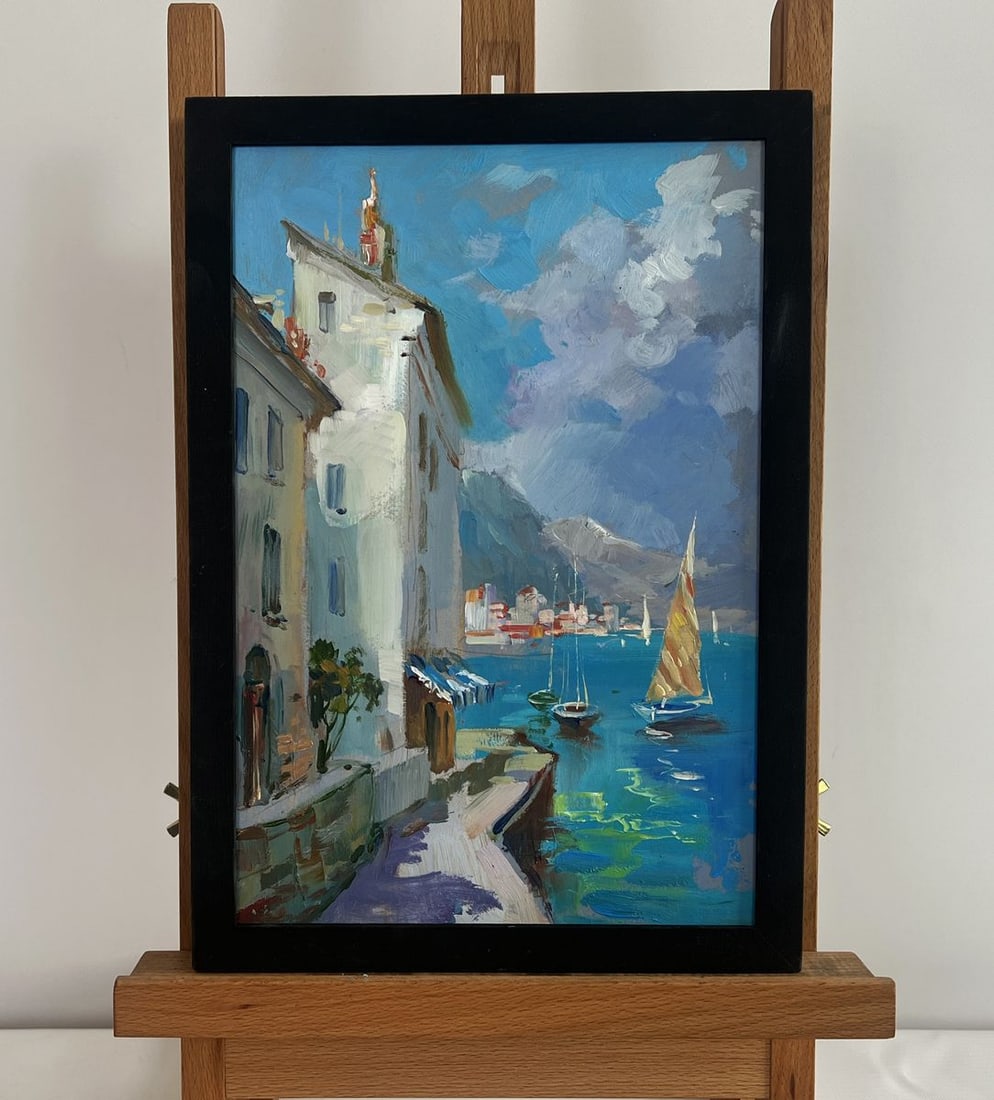 Oil painting Sunny days by the sea Yuriy Suprunchuk: NoAAA4456The painting "Sunny Days by the Sea" captures a serene coastal town bathed in warm sunlight, where the charm of old buildings meets the vastness of the open sea. The artist masterfully portra