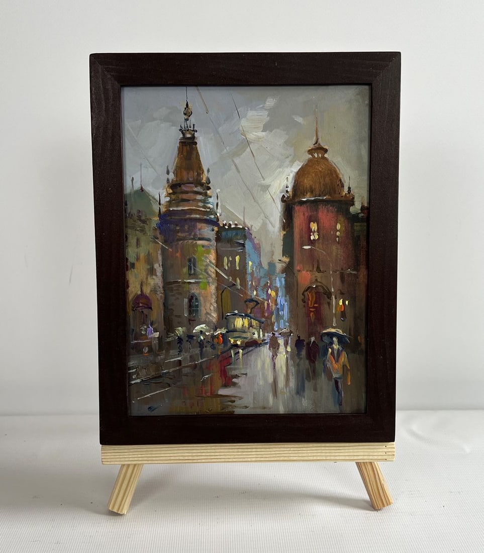 Oil painting Dynamics of urban life Yuriy Suprunchuk: NoAAA4340The painting "Dynamics of Urban Life" beautifully captures the restless energy of a bustling city, where history and modernity intertwine under a rain-soaked sky. The artist skillfully
