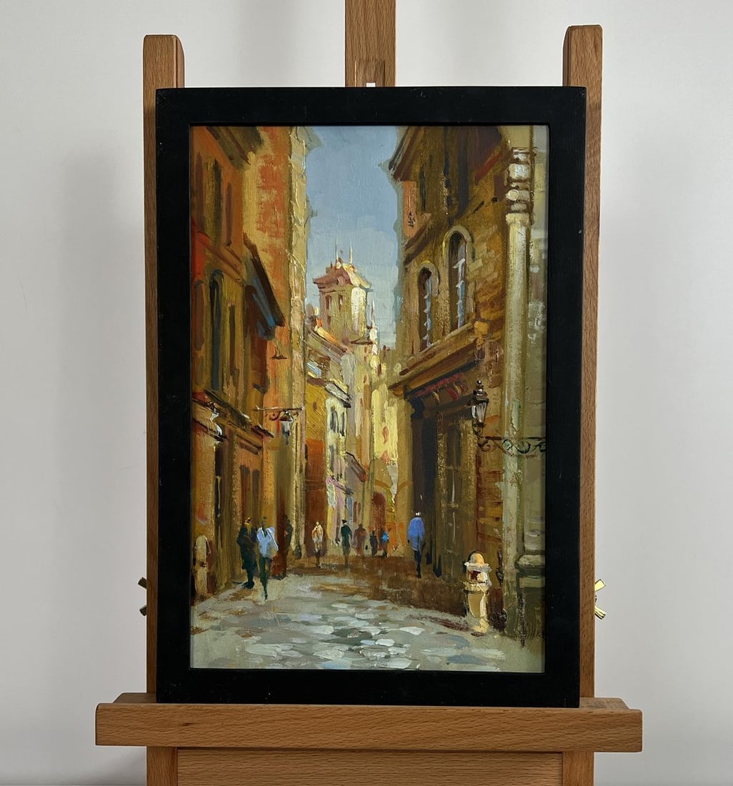 Oil painting Walking along the street of the city Yuriy Suprunchuk: NoAAA4366The painting "Walking along the street of the city" captures the timeless charm and warmth of an old European street, bathed in the golden hues of the afternoon sun. The narrow cobblestone pa