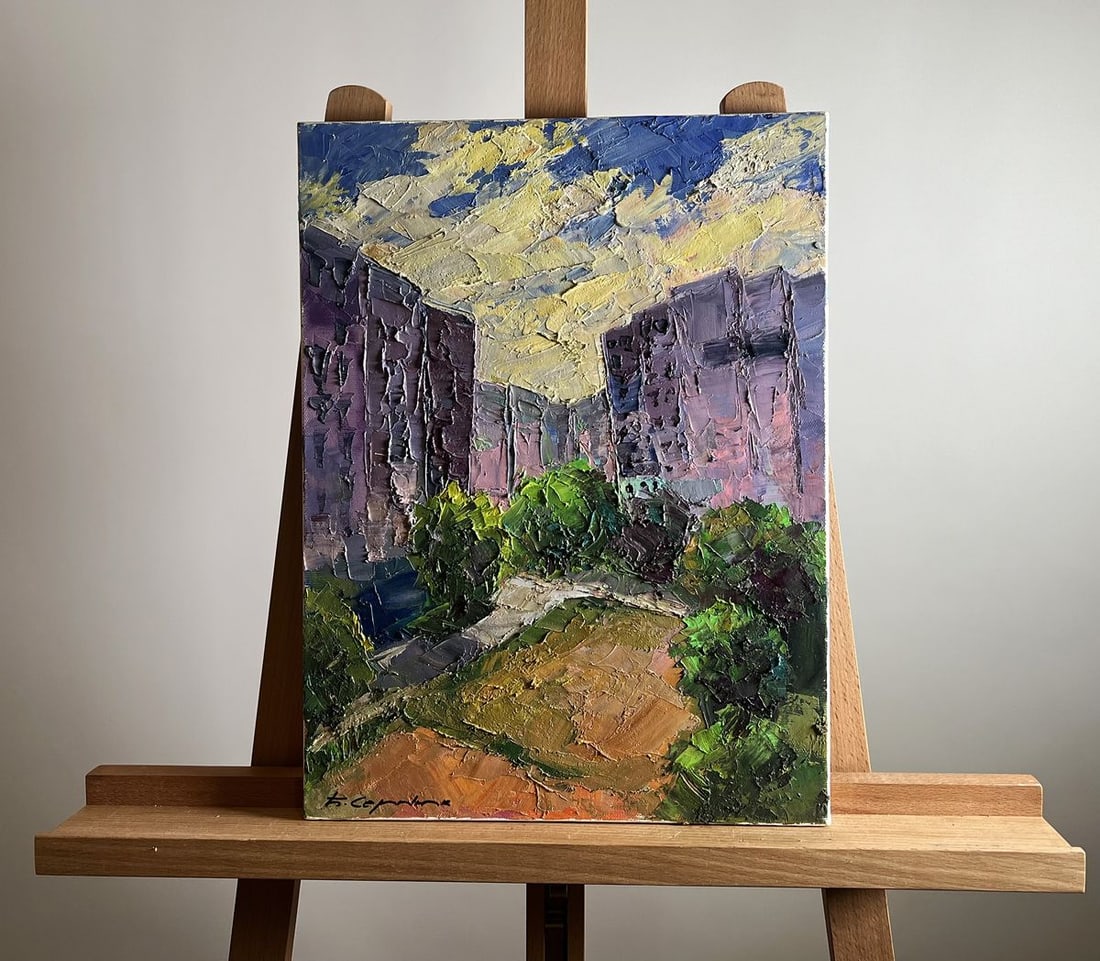 Oil painting Summer day in the city Boris Serdyuk: NoAAA3759The oil painting on cardboard, titled "Summer Day in the City", captures the contrast between urban architecture and the natural elements that soften its rigid structures. The artist employs 