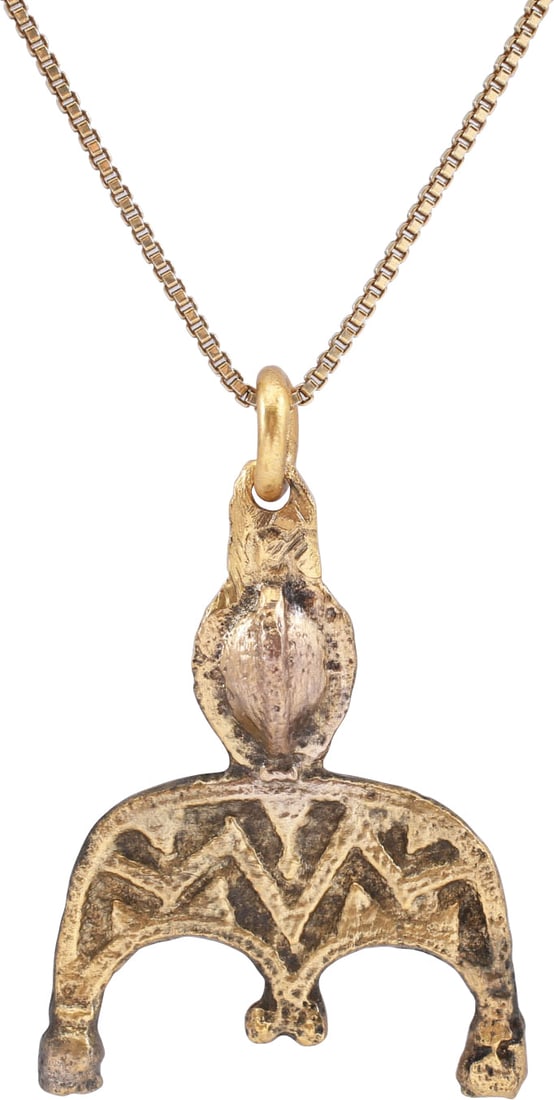 FINE VIKING LUNAR PENDANT NECKLACE, 10TH-11TH CENTURY AD: Over 7/8" in height plus the suspension loop. Bronze, cast, and chased in detail as the crescent moon with baluster tips representing Sol the sun and Mani the moon. The field within the raised edges i