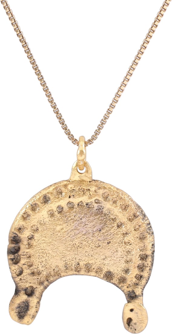 VIKING LUNAR PENDANT NECKLACE: 10th- 11th century. Just over 7/8" width of broad crescent form with punch edged field within raised punched borders. The tips with circles representing Sol the sun and Mani the moon. Reverse matching