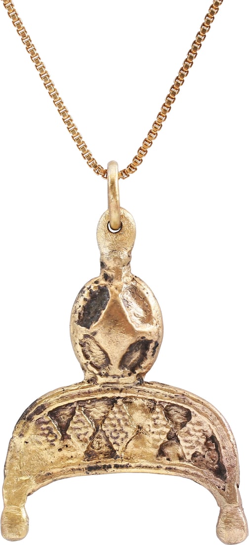 SUPERB VIKING LUNAR PENDANT NECKLACE, 9TH-10TH CENTURY AD: Slightly under 1 1/4" height (1.23"). Gilt bronze, cast, and chased in minute detail as the crescent moon with baluster tips representing Sol the sun and Mani the moon. The body finished in detail,
