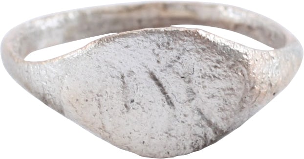 VIKING WARRIOR'S RING C.850-1050 AD, SIZE 8 ¼: Silvered bronze, with 1.8mm rounded face band flaring to the shoulders. Oval bezel with an inscription in five strokes, of Viking runes (?). Surface textured from burial and professionally refurbished
