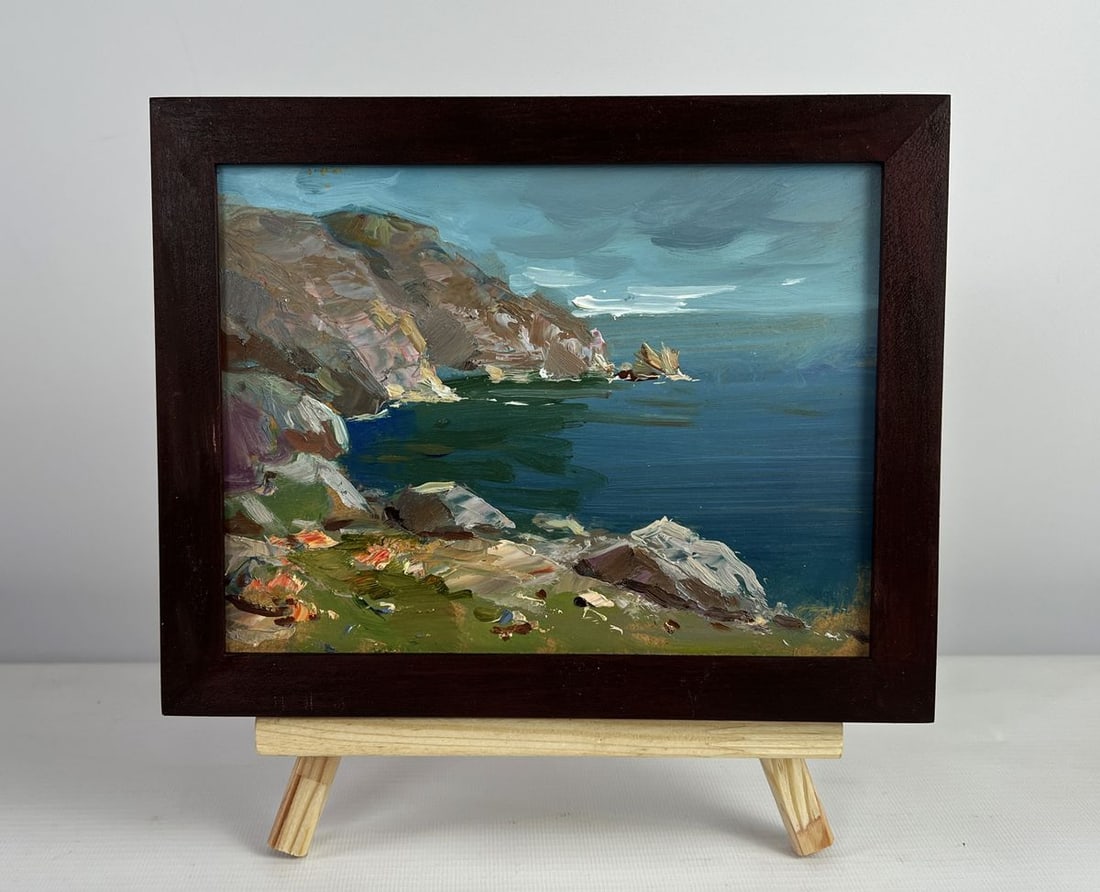 Oil painting Sea breeze on the shore Yuriy Suprunchuk: №AAA4972The oil painting on cardboard titled "Sea Breeze on the Shore" transports the viewer to a rugged coastal landscape where nature’s raw beauty unfolds in brushstrokes that are both