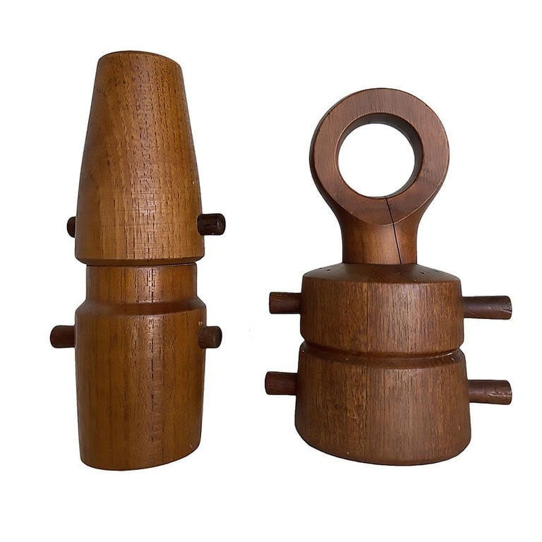 1960s Danish Modern Carved Teak Pepper Grinder Set by Jens Quistgaard: Set of 2 Vintage Mid Century Modern Jens Quistgaard made in Denmark pepper grinders. Jens Quistgaard is a celebrated brand synonymous with mid-century Scandinavian design excellence. Founded by the Da
