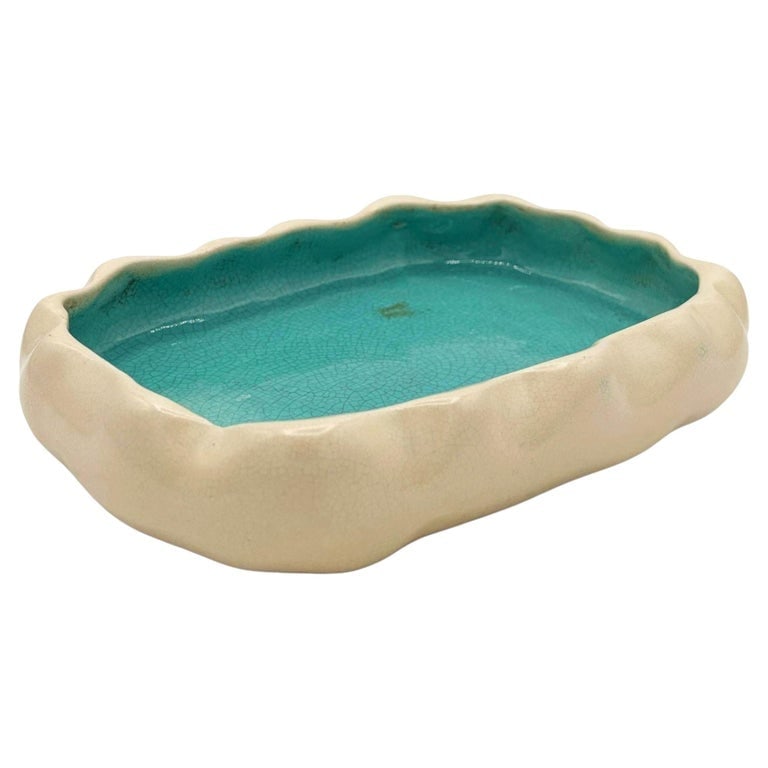 Mid-century Low Edged Aqua Colored Pond Themed Pottery Candy Dish: Mid-century low edged aqua colored pond themed pottery candy dish Featuring a dual-toned crackle glaze finish. The exterior features a smooth, undulating rim with rock-like or lobed curves, finished i