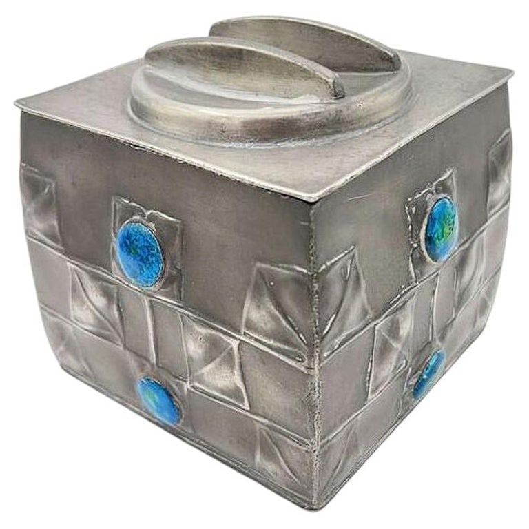 Rare Arts and Crafts #0194 Tudric Pewter Box by Archibald Knox for Liberty and Co: Rare Arts and Crafts English pewter biscuit box produced by Liberty and Co., London, from the celebrated Tudric line, circa 1902. This rectangular form features a domed lid, geometric hand-chased deco