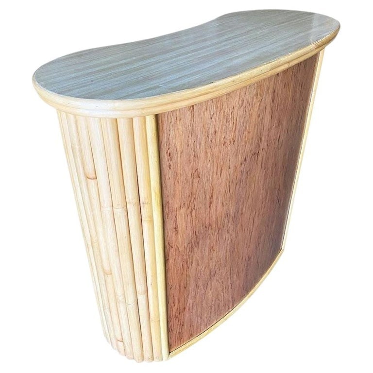 Restored Mid-century Vertically Stacked Curved Stacked Dry Rattan Bar: This beautifully restored Frankl style coastal rattan bar blends vintage charm with modern comfort. It features curved rattan vertically stacked poles and a natural wood front with a matching