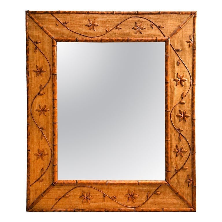 1960s Italian Coastal Carved Ornate Bamboo and Rice Mat Riviera Wall Mirror: This exceptional mid-century era Italian rectangular wall mirror features the style popular in the Italian Riviera in the 1960s. Masterfully crafted, the piece features a prominent, double-layered fra