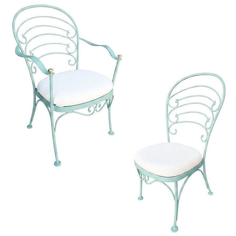Restored Teal "Ribcage" Patio/Outdoor Lounge Chair W/ Brass by Woodard, Set of 2: A set of two Woodard rod iron "Ribcage" outdoor/patio featuring one armchair and one side chair. This chair is constructed with solid iron castings and is finished in teal. All outdoor furniture can