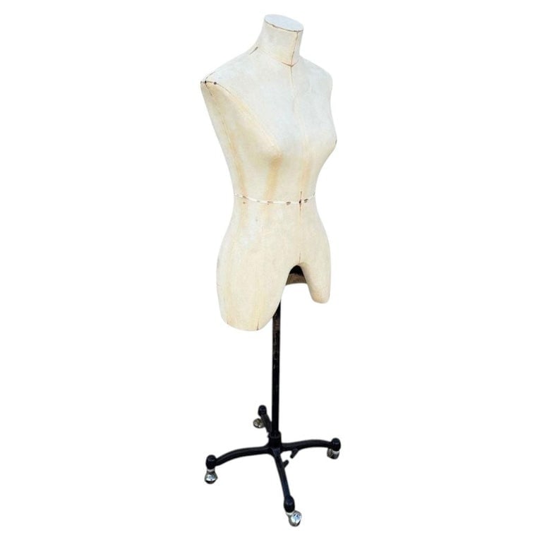 Adult Female White Linen Dress Form Mannequin on Iron Base w/ Wheels Size 8: An exceptional female dress form, beautifully preserving the classic contours and utilitarian elegance of mid-century design. This antique mannequin features a beautifully structured linen/canvas
