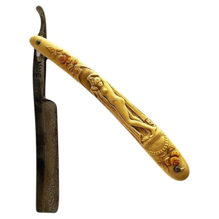 Rare figure Goddess Art Nouveau Celluloid Straight Razor by Ern. C. Friedr: Rare figure Art Nouveau celluloid handle Straight Razor. This is a great antique straight razor with a detailed Art Nouveau figure standing in a greek setting leaf carved into the handle. Some of the 