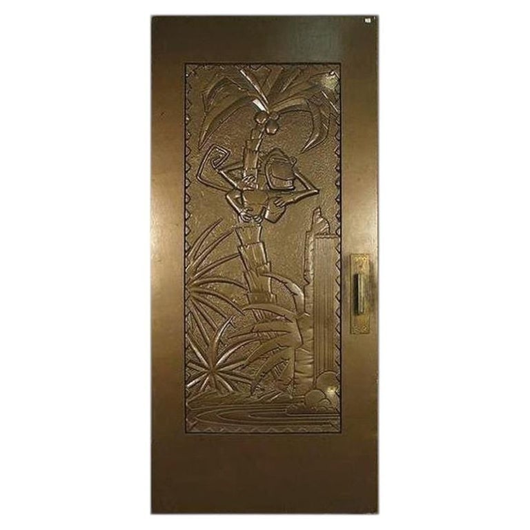 Large 93" Art Deco Style Coco Bongo Gold Door From 1994 The Mask, 2 Available: Large Gold 7' Foot Coco Bongo Door custom-made for the 1994 film "The Mask" starring Jim Carrey. This large gold door is made of a wood door frame with a molded Fiberglass picture of the club mascot