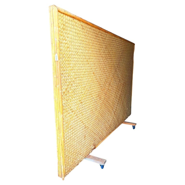Mid-Century 9' Foot X 6' Foot Rattan and Woven Wicker Wall Divider w/ Wheels: This beautifully restored coastal 1939 Rolling pole rattan room divider woven wall in the style of mid-century designers like Paul Frankl and Paul Laszlo. This wall was used in the LA furniture show i