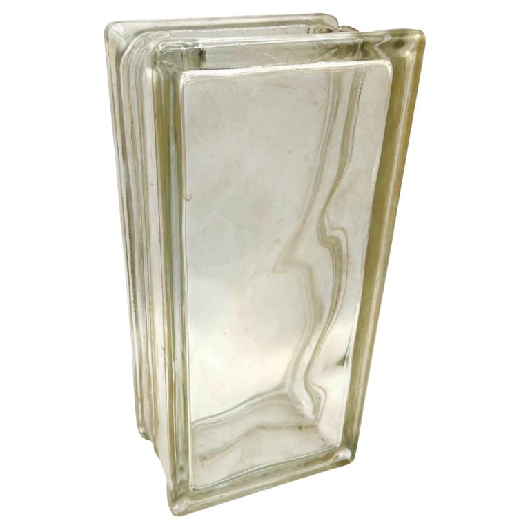 1970 Brutalist Postmodern Tallboy Glass Block Table Vase, West Germany: Original 1970s Brutalist glass block table vase popular in West Germany during the 1960s and 70s it features a 3" opening along the top for receiving a floral arrangement of choice. Known for their