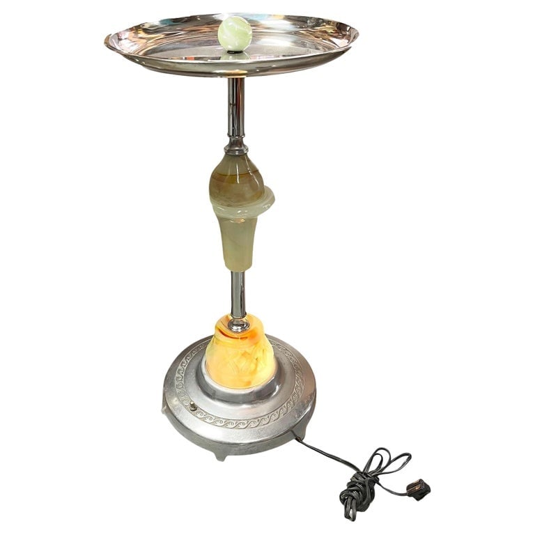 Streamline Art Deco Chrome Drink Glass Top Side Table w/ Light Up Base: Art Deco chrome round chrome top side drinks table featuring a light-up art glass center with an additional light-up art glass base. This dual-purpose accent lamp and side table piece boasts a Art Dec