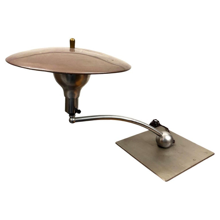 Mid-century M.G. Wheeler "Sight Light" Brushed Steel Table Lamp w/ Enamel Shade: This "Sight Light" manufactured by M.G. Wheeler features a curved neck and with a body composed of brass with enameled steel accents in beige. Iconic design by Leroy for the M.G. Wheeler Co made