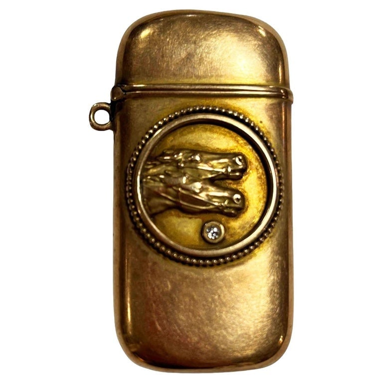 Late Victorian Western 10K Gold Stallion Pair Match Safe Vesta w/ Diamond: This stunning match safe/vesta case is a beauty. It dates from the Late Victorian Western erain 1890 . It is crafted in 10k yellow gold. The center features a pair of Stallion horses adorned with a di