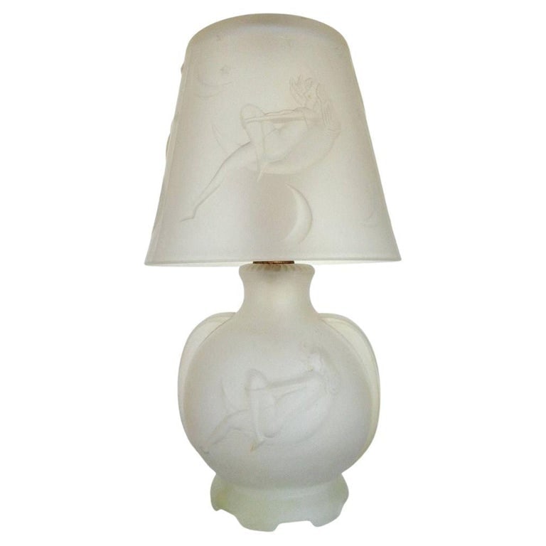 1984 Art Deco Lay by the Stars Crescent Moon Boudoir Glass Lamp by Sarsaparilla: Re-edition frosted glass boudoir lamps, each known as the "Lay by the Stars," features a Figure woman gazing at the stars inside a crescent moon, made by Sarsaparilla . They showcase a serene Figure