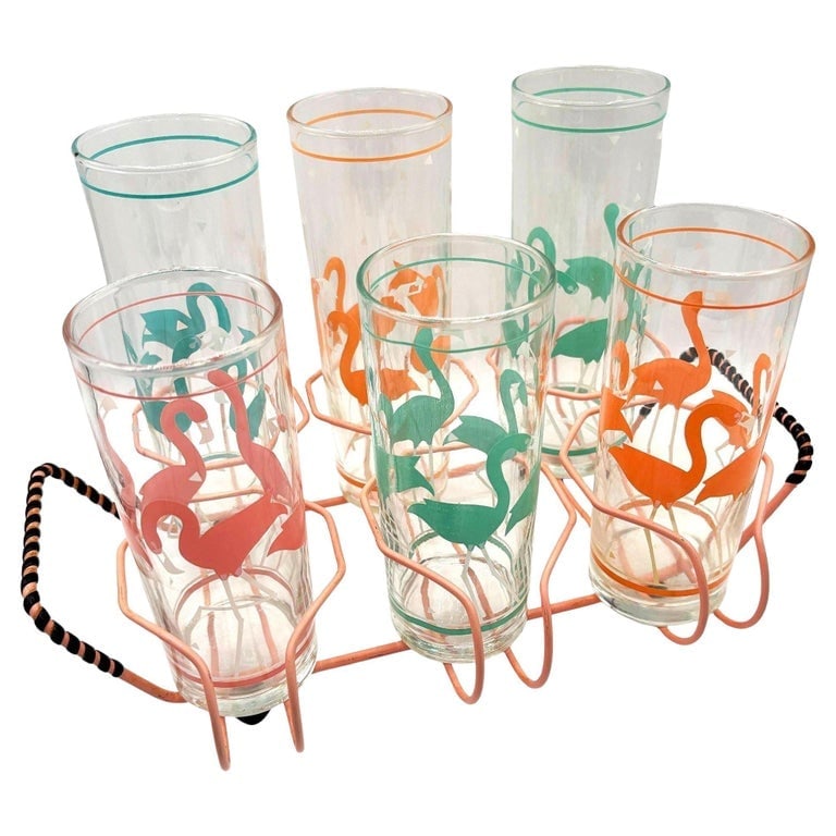 Mid-Century Pink Wire Frame Drinks Tray w/ Six Highball Flamingo Glasses: Add a tropical vibe to cocktail time with these vintage Libbey flamingo highball glasses. All four glasses have flamingo motifs done in colored enamel: two orange, one pink, and one green. There are